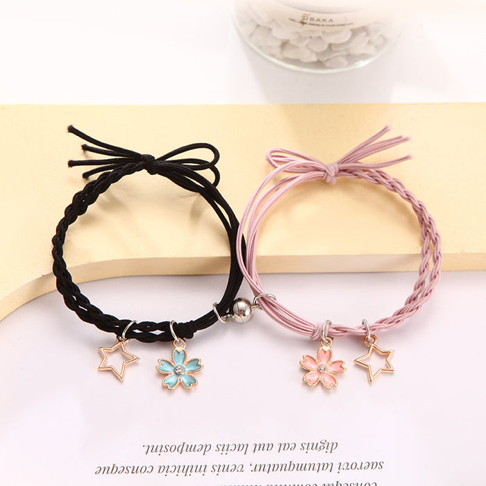 Wholesale Cartoon couple bracelets a pair of small rubber band magnets attract bell bracelet gift