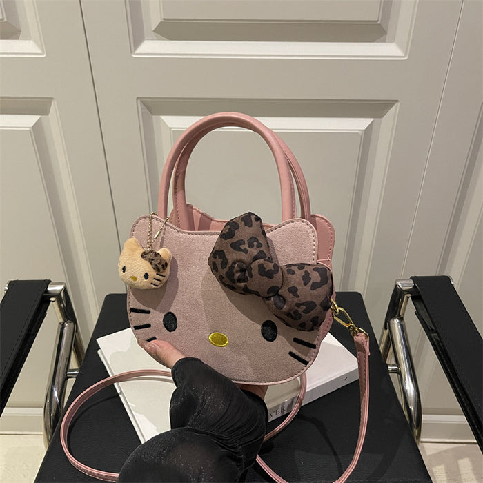Wholesale Cute cartoon shoulder bag with leopard print bow.