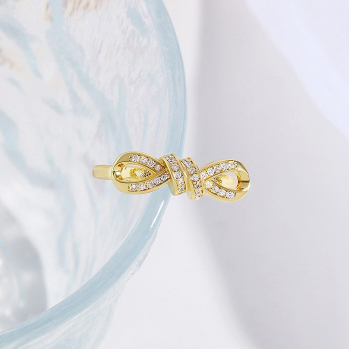 Wholesale Copper Gold Plated Irregular Zircon Twisted Rope Bow Ring JDC-RS-BaiTian004