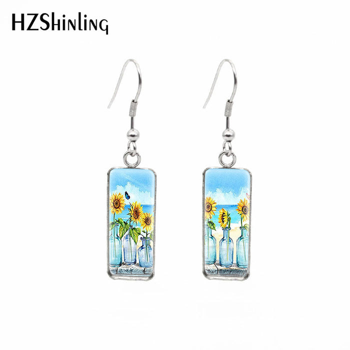 Wholesale Independently packaged hook flower pendant earrings, creative time gemstone earrings