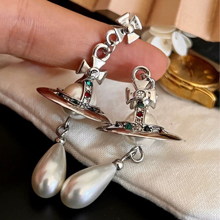 Wholesale UFO-engraved Saturn gold and silver teardrop pearl earrings