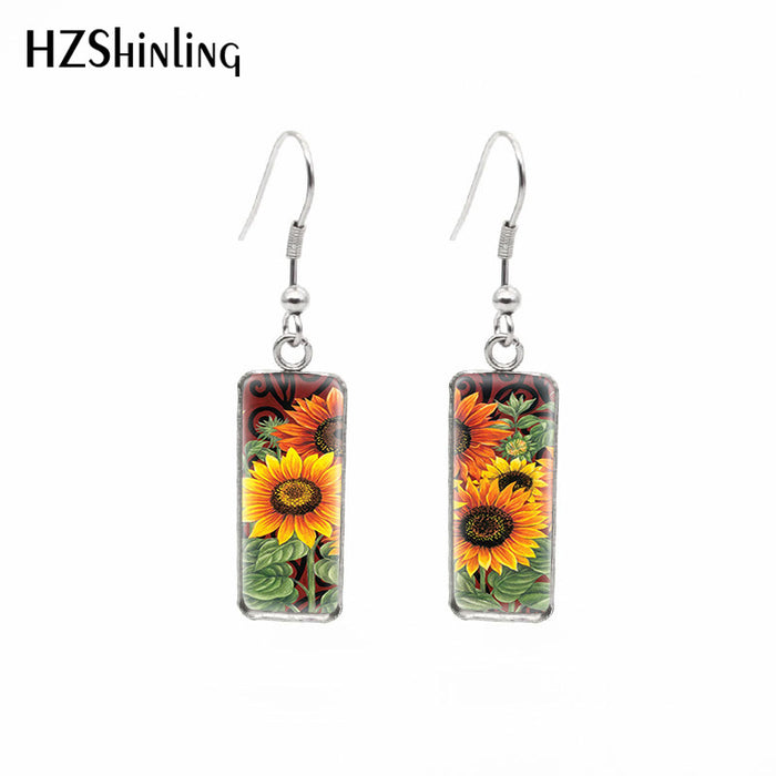 Wholesale Independently packaged hook flower pendant earrings, creative time gemstone earrings