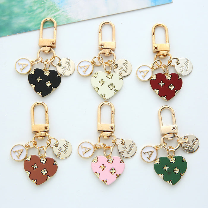 Wholesale alloy love keychain pendant hollow small flower letter round card accessories