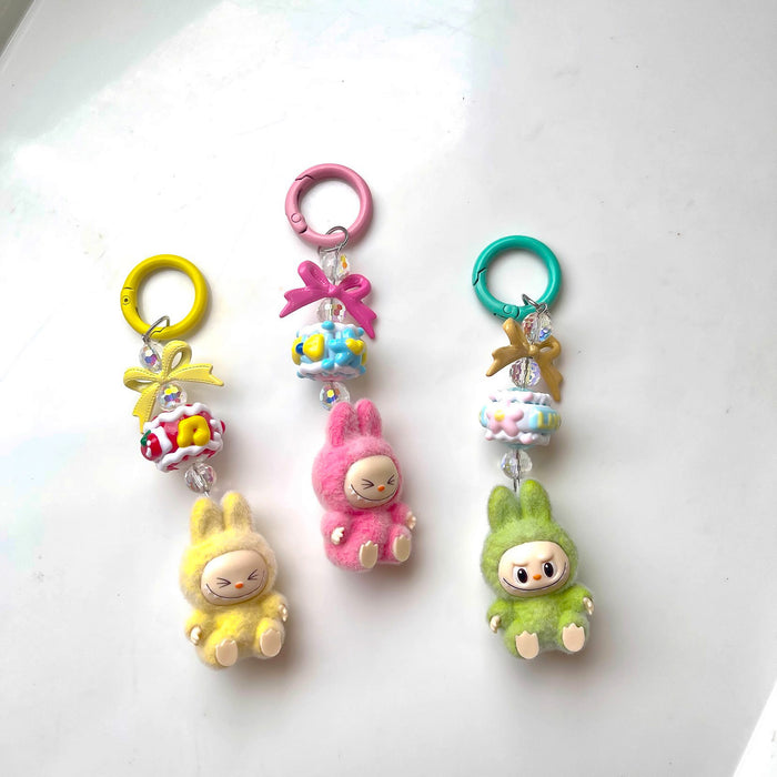 Wholesale Flocked Mini Keychain Vinyl Cute Baby Walking Bag Mobile Phone Pendant Cute Pendant