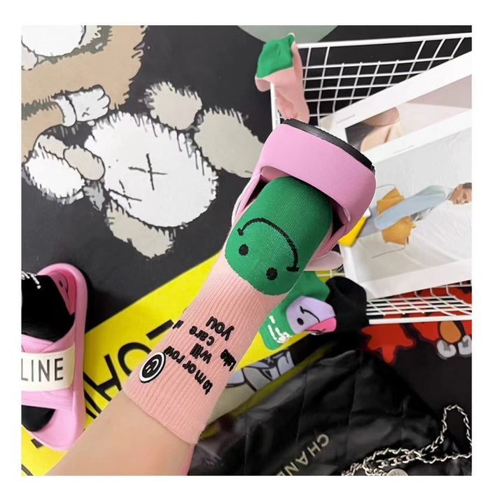 Wholesale Colorful socks with smiley face and letter print on the outside, with a pile of socks in the middle