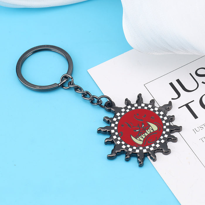 Wholesale Zinc alloy red demon face sun pendant keychains