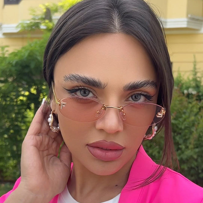 Wholesale Elliptical frame small frame sunglasses, new frameless cut edge personalized glasses, dot diamond sunglasses