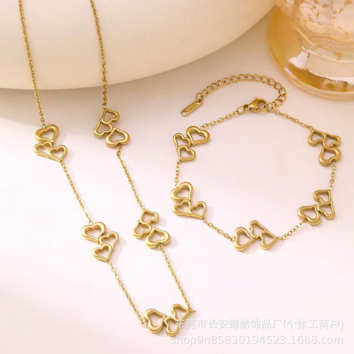 Wholesale Hollow out three-heart stainless steel necklace and bracelet set