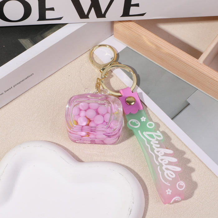 Wholesale Creative personality small square oil quicksand key chain acrylic student backpack mobile phone pendant pendant small gift