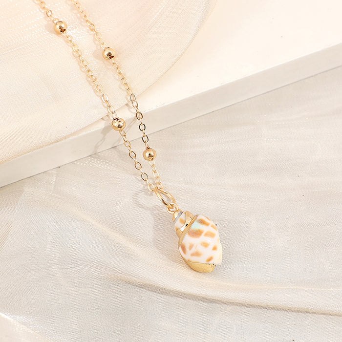 Wholesale Gold edged conch and seashell necklace