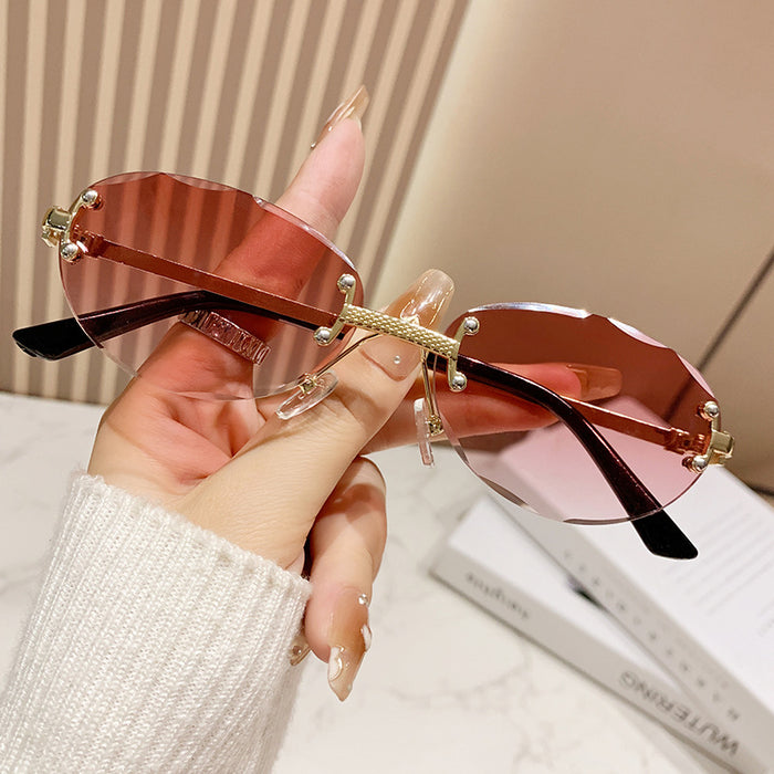 Wholesale Frameless cut sunglasses, fashionable oval frame glasses, gradient sunglasses