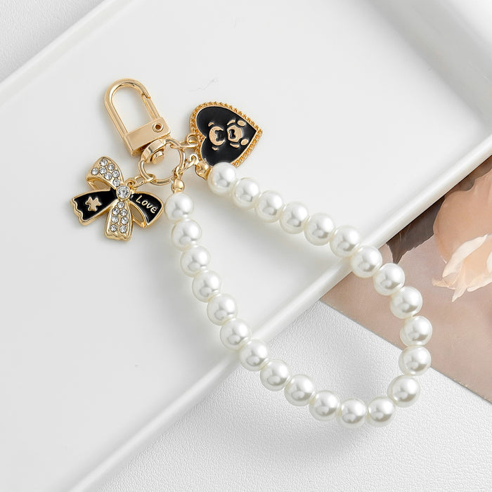 Wholesale Pearl chain beaded mobile phone lanyard bow pendant keychain