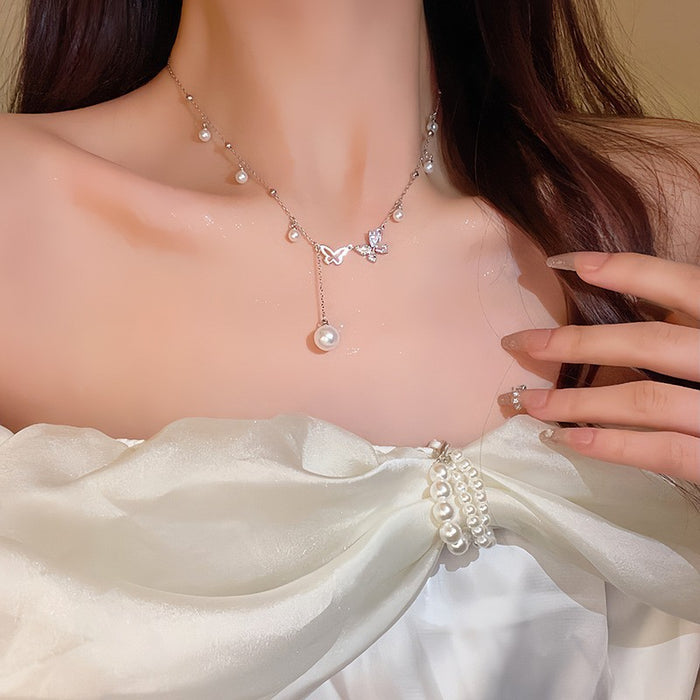 Wholesale Asymmetric hollow butterfly pearl necklace, light luxury, niche collarbone chain accessory, neckchain
