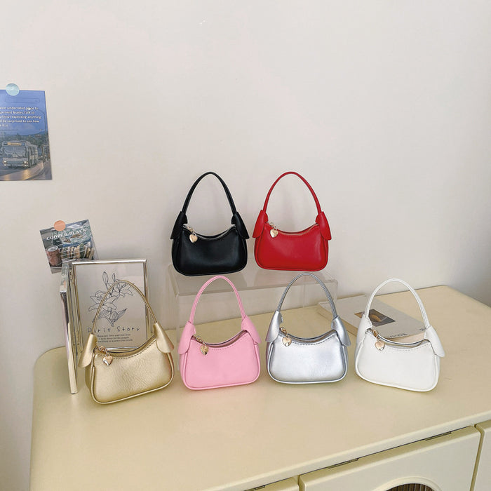 Wholesale Korean Style Solid Color PU Children' s Handbag with Heart Zipper Pull Cute Casual Accessory