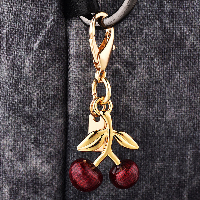 Wholesale Car key pendant high sense bag accessories gold color bear cherry four-leaf clover butterfly schoolbag jewelry