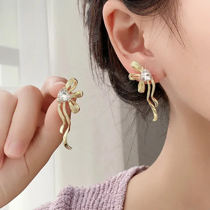 Wholesale Ribbon bow, silver needle, heart-shaped diamond studded earrings, simple and high-end, versatile earrings, fashionable and personalized earrings