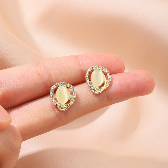 Wholesale Round cat eye stone earrings, simple and gentle sparkling diamond earrings, retro temperament, daily earrings