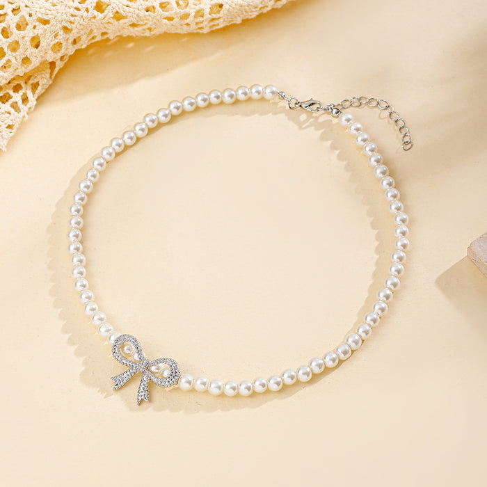 Wholesale Jewelry Fashion Pearl Necklace Versatile Diamond Set Bow Sweater Chain Versatile Pendant