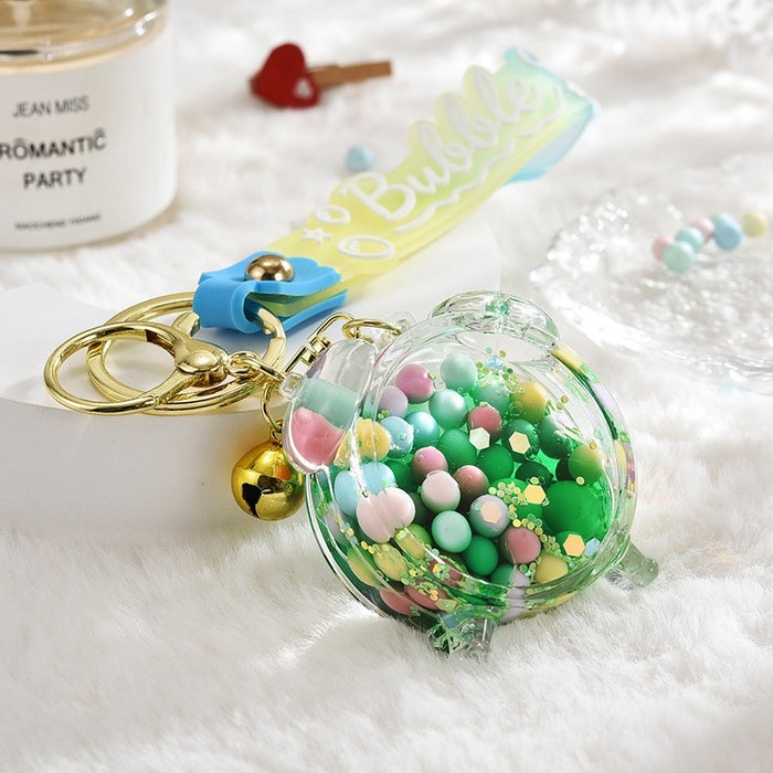Wholesale Acrylic oil bottle candy Bean astronaut keychain