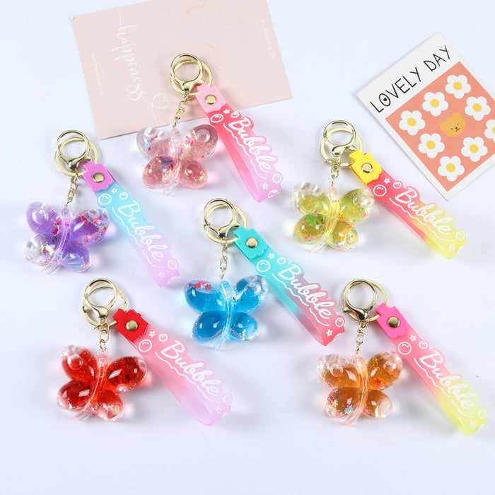 Wholesale Acrylic oil butterfly quicksand keychain bag pendant candy color