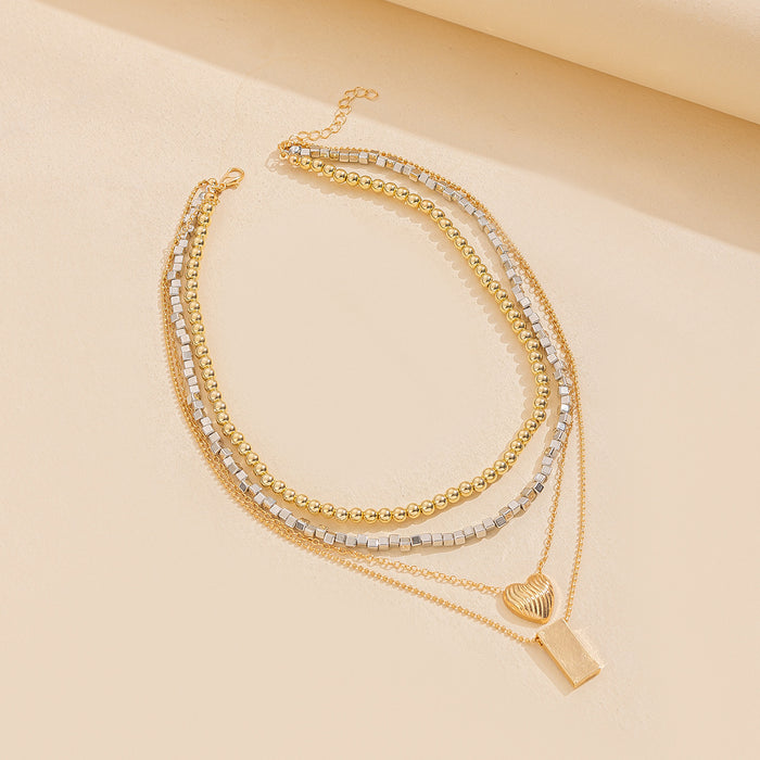 Wholesale Artistic retro layered necklace with gold and silver color blocking design, layered and heart-shaped square pendant