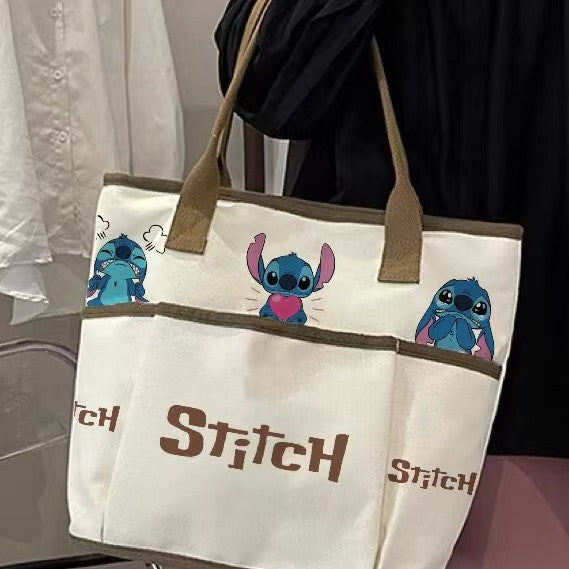 Wholesale Cartoon canvas bag for women's casual and versatile, hand-held for outdoor use, large capacity practical shoulder bag