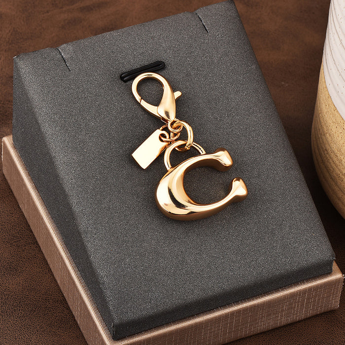 Wholesale Car key pendant high sense bag accessories gold color bear cherry four-leaf clover butterfly schoolbag jewelry