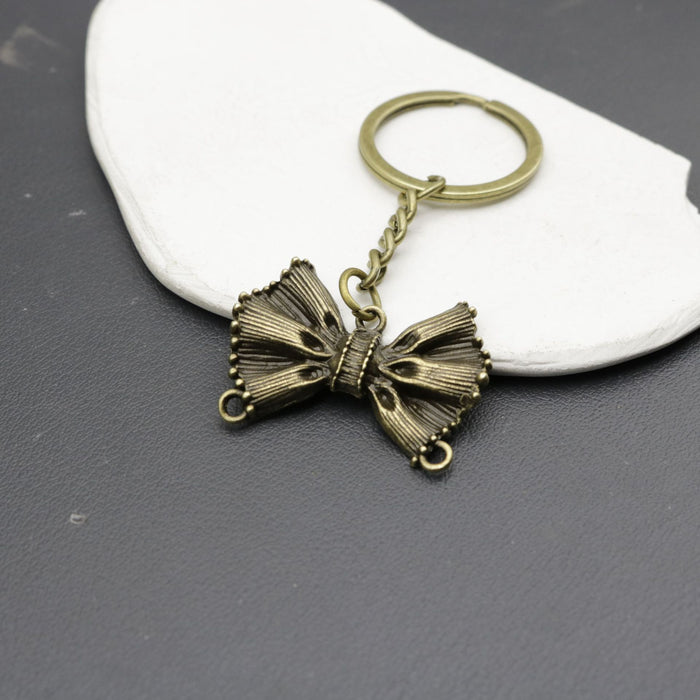 Wholesale Iron Alloy Simple Bow Keychain JDC-KC-HEMS003