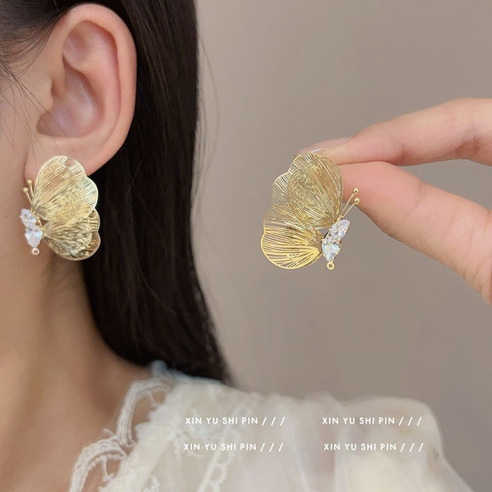 Wholesale Sparkling diamond dynamic hollow butterfly tassel earrings, light luxury temperament, high-end feeling, niche earrings, exaggerated earrings