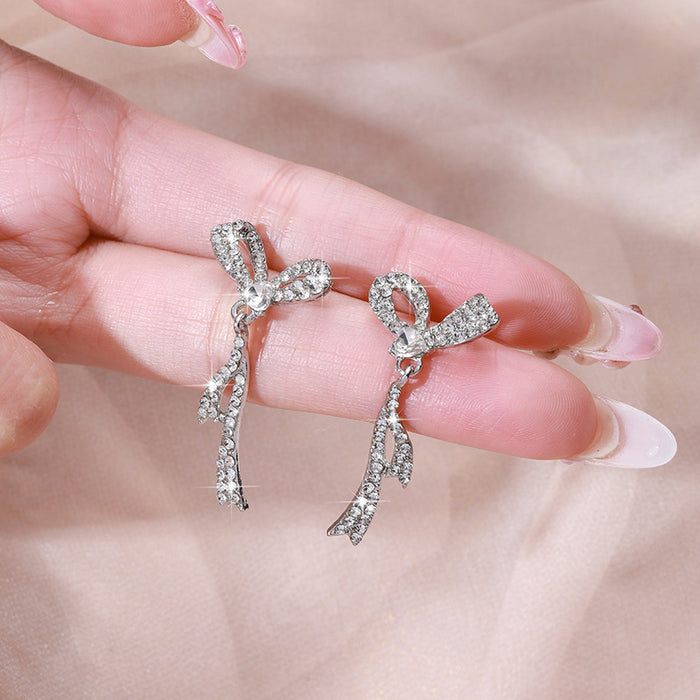 Wholesale Silver needle bow tassel earrings for women