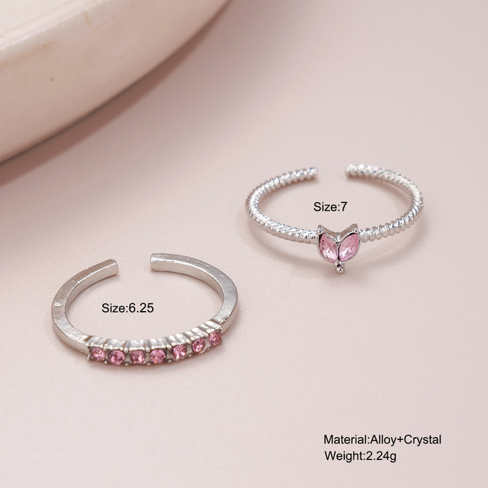 Wholesale Set of open-faced diamond-encrusted heart-shaped rings.