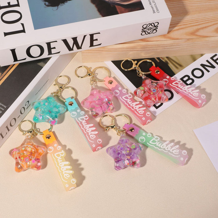 Wholesale five-pointed star flower quicksand bottle creative colorful cartoon bag key chain jewelry small pendant ornaments color
