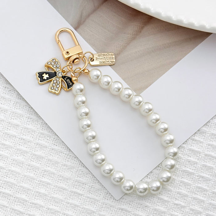 Wholesale Pearl chain beaded mobile phone lanyard bow pendant keychain