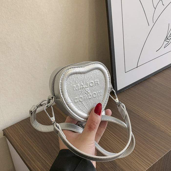 Wholesale New embossed letter love bag for children, stylish mini crossbody bag, hand-held bag