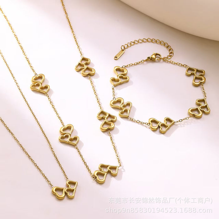 Wholesale Hollow out three-heart stainless steel necklace and bracelet set