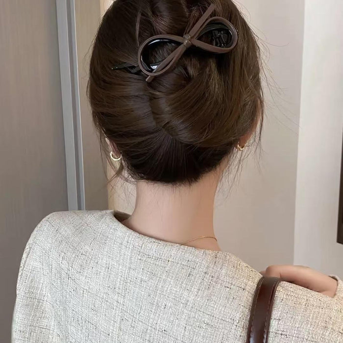 Wholesale Temperament leather bow twist clip hair with a high-end feel, straight clip headband accessory