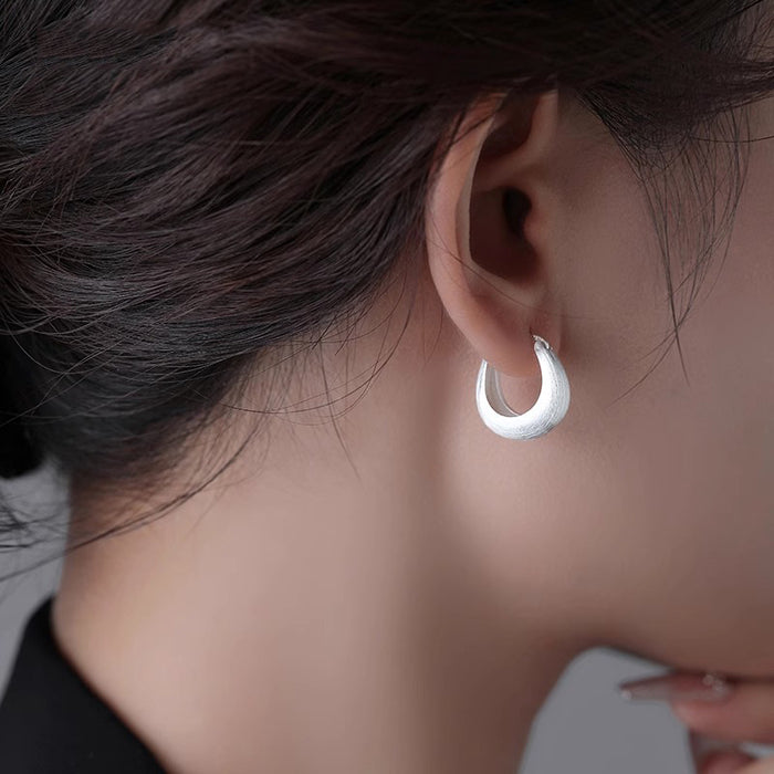 Wholesale Brushed silk ring earrings with temperament, ear buckles with a niche and high-end feel, silver needle earrings, and new earrings