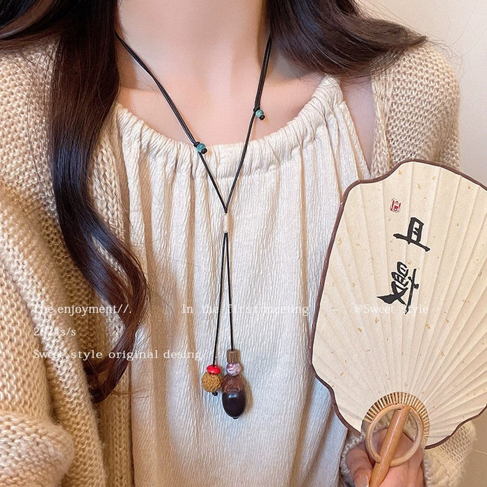 Wholesale Vintage feather necklace, double-layer layered long sweater chain accessory
