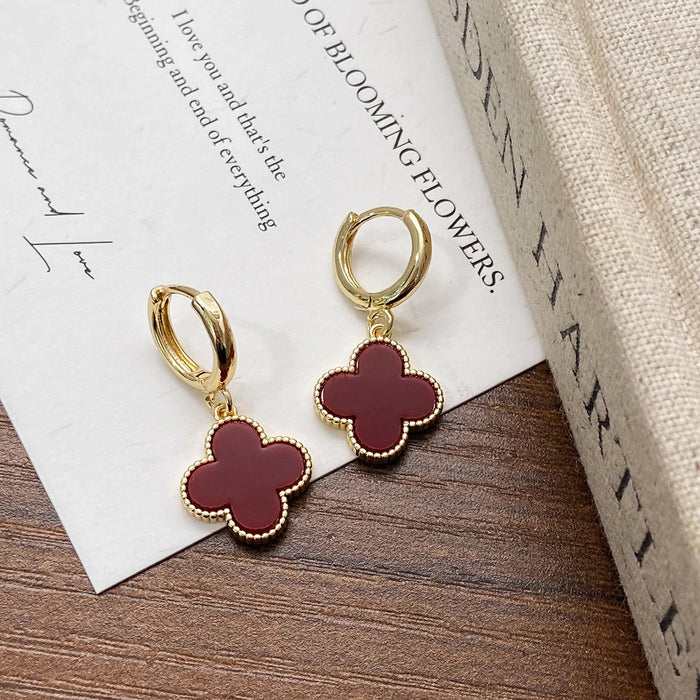 Wholesale Simple lucky flower gold plated earrings