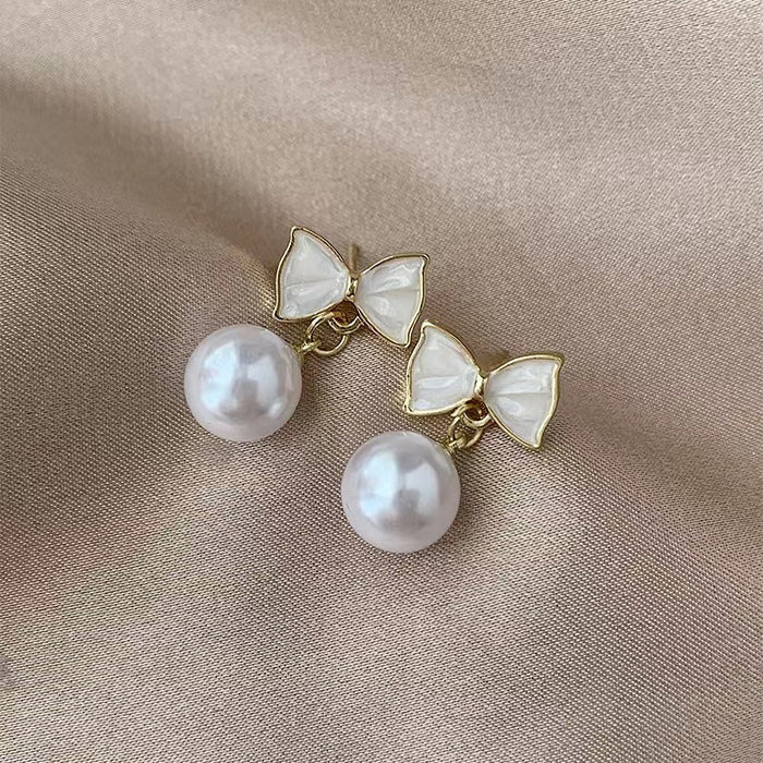 Wholesale New pearl bow pearl earrings, fashionable oil dripping accessories, high-end and versatile trendy earrings