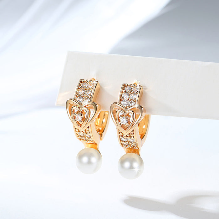 Wholesale Copper gold-plated retro light luxury simple pearl earrings, small and fashionable design, inlaid with zircon ear buckles, wholesale of ear accessories