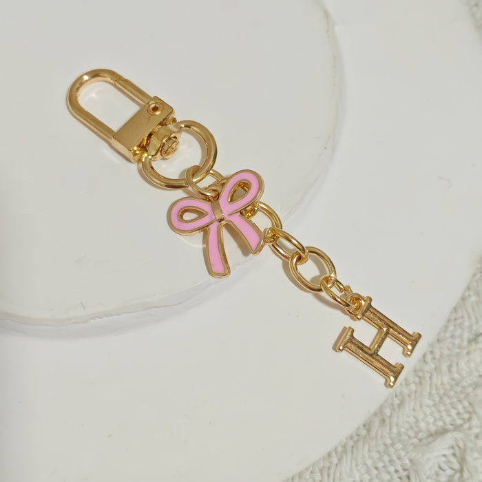Wholesale Pink bow A-Z keychain alloy accessory