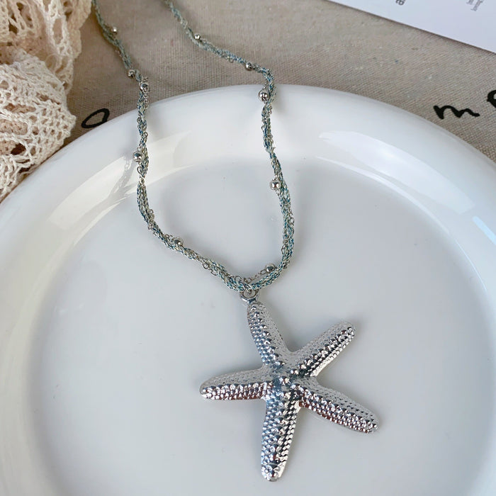 Wholesale Seaside metal starfish pendant necklace with niche design, simple and long necklace accessories