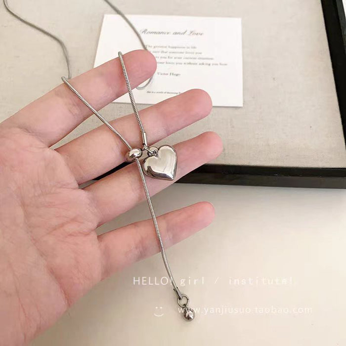 Wholesale Minimalist silver heart pendant necklace, women's light luxury high-end feel, long sweater chain accessory