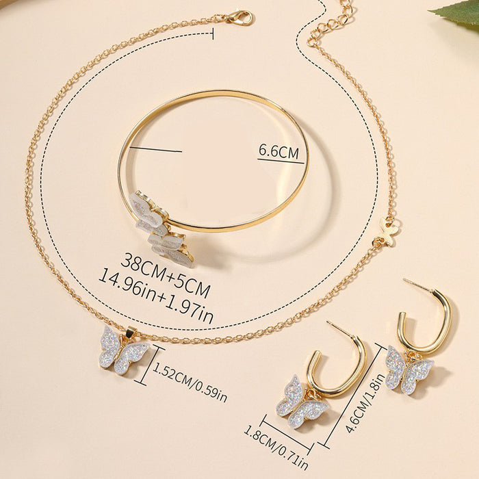 Wholesale Versatile alloy butterfly earrings, bracelets, necklaces, four piece jewelry pendant set
