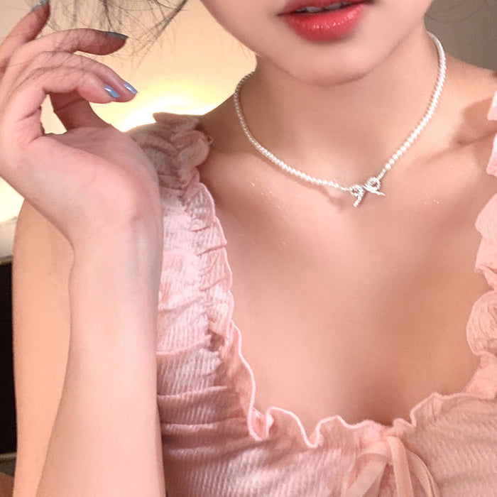 Wholesale Butterfly knot pearl necklace, simple and niche fashion, light luxury, versatile collarbone chain accessories