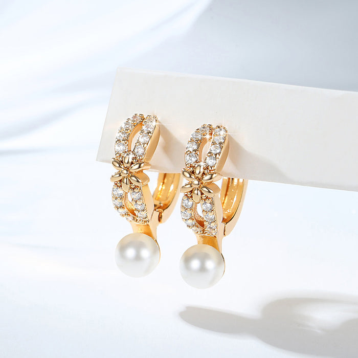 Wholesale Copper gold-plated retro light luxury simple pearl earrings, small and fashionable design, inlaid with zircon ear buckles, wholesale of ear accessories