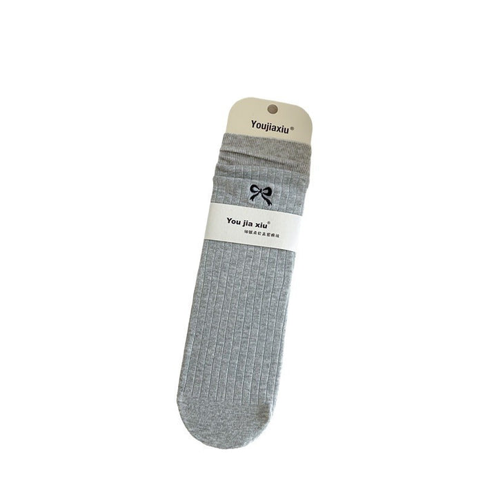Wholesale Butterfly knot embroidered socks, solid color boneless pile socks, white socks