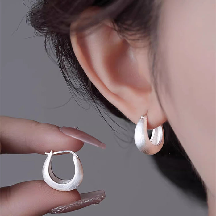 Wholesale Brushed silk ring earrings with temperament, ear buckles with a niche and high-end feel, silver needle earrings, and new earrings