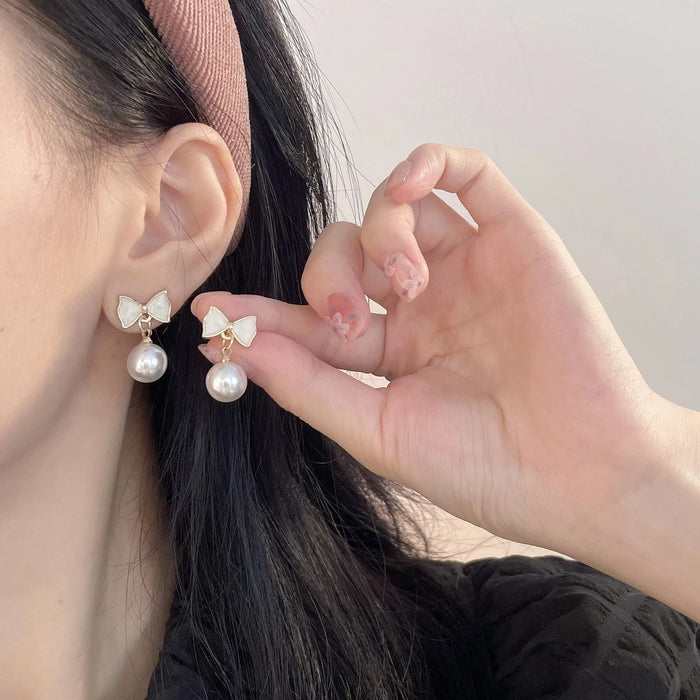 Wholesale New pearl bow pearl earrings, fashionable oil dripping accessories, high-end and versatile trendy earrings
